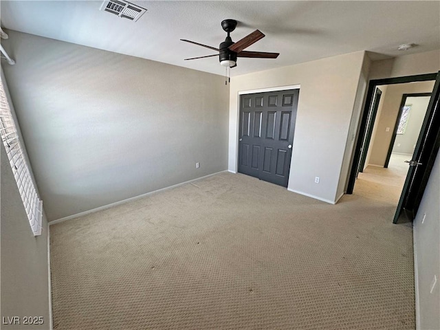 3938 E Chaffe Ave, Pahrump, NV 89061 - unfurnished bedroom with a closet, baseboards, carpet, and a ceiling fan