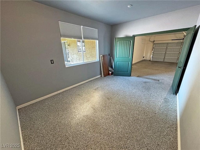 3938 E Chaffe Ave, Pahrump, NV 89061 - unfurnished bedroom featuring baseboards and a garage