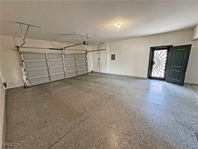 3938 E Chaffe Ave, Pahrump, NV 89061 - garage featuring a garage door opener and baseboards