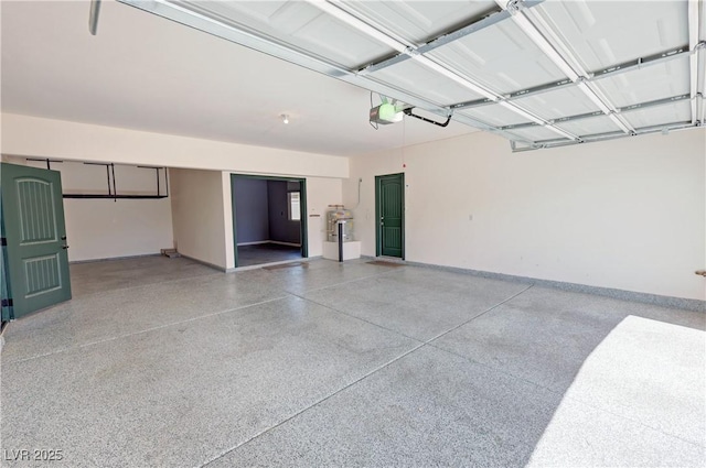 3938 E Chaffe Ave, Pahrump, NV 89061 - garage featuring a garage door opener and baseboards