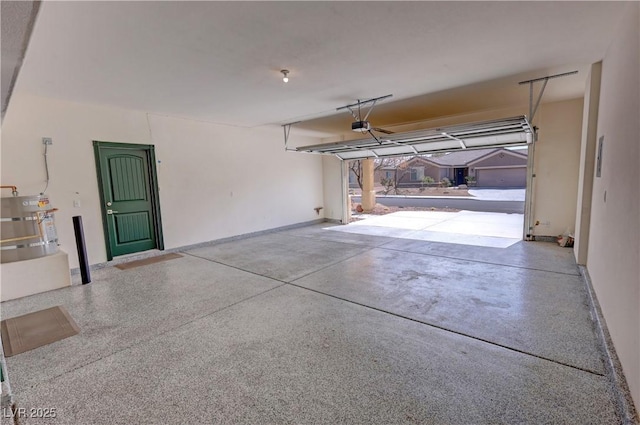 3938 E Chaffe Ave, Pahrump, NV 89061 - garage with a garage door opener, water heater, and baseboards