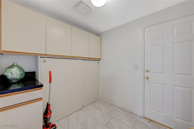 8591 Heather Downs Dr, Las Vegas, NV 89113 - laundry room with light marble finish flooring