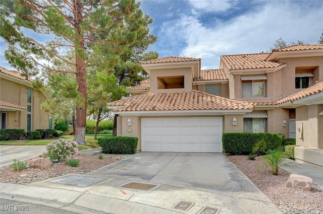 8591 Heather Downs Dr, Las Vegas, NV 89113 - view of front of house featuring concrete driveway, stucco siding, a garage, and a tiled roof