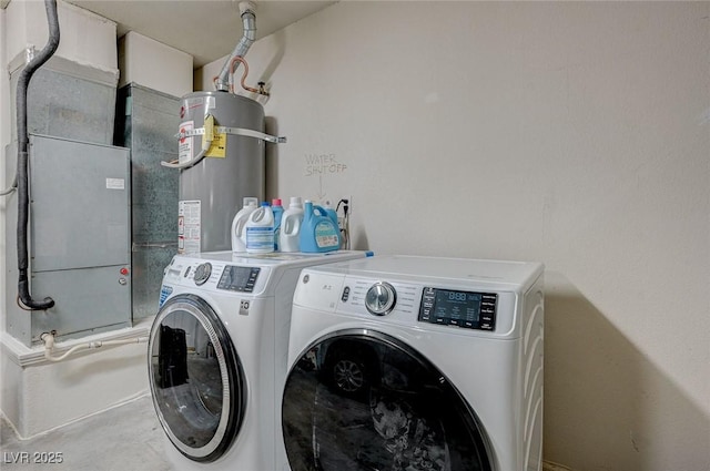 8591 Heather Downs Dr, Las Vegas, NV 89113 - clothes washing area featuring independent washer and dryer and strapped water heater
