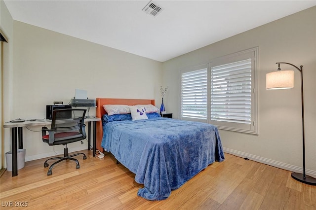 8591 Heather Downs Dr, Las Vegas, NV 89113 - bedroom featuring wood finished floors, baseboards, and a desk