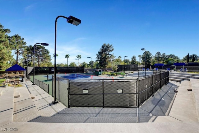 8591 Heather Downs Dr, Las Vegas, NV 89113 - view of swimming pool with a tennis court and fence