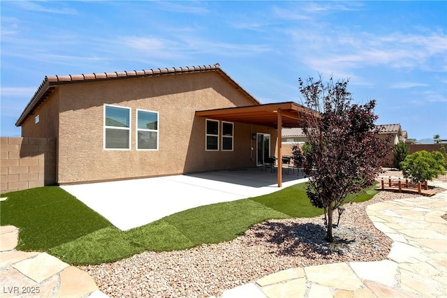 3543 E Malheur Ave, Pahrump, NV 89061 - back of house with a fenced backyard, stucco siding, and a patio
