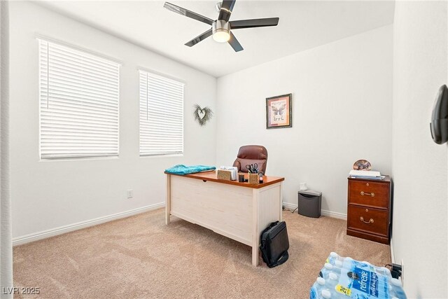 3543 E Malheur Ave, Pahrump, NV 89061 - home office featuring light carpet, ceiling fan, and baseboards