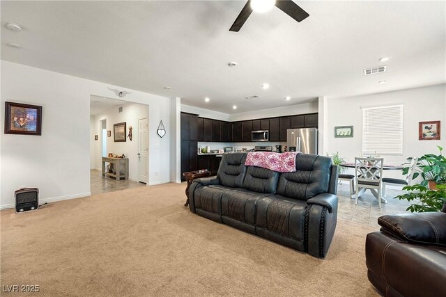 3543 E Malheur Ave, Pahrump, NV 89061 - living area with light colored carpet, a ceiling fan, baseboards, and recessed lighting