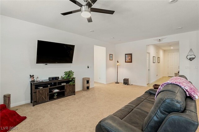 3543 E Malheur Ave, Pahrump, NV 89061 - living area featuring ceiling fan, light carpet, and baseboards