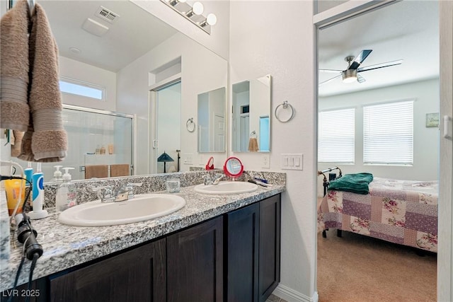3543 E Malheur Ave, Pahrump, NV 89061 - ensuite bathroom featuring a stall shower, ceiling fan, and double vanity