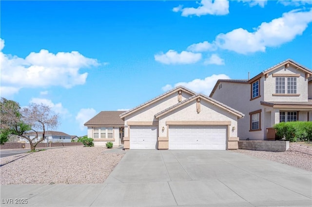 82 Autumn Day St, Henderson, NV 89012 - view of front of home featuring stucco siding, driveway, a garage, and a tile roof