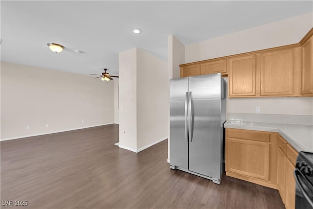 82 Autumn Day St, Henderson, NV 89012 - kitchen with freestanding refrigerator, stove, a ceiling fan, light countertops, and dark wood finished floors