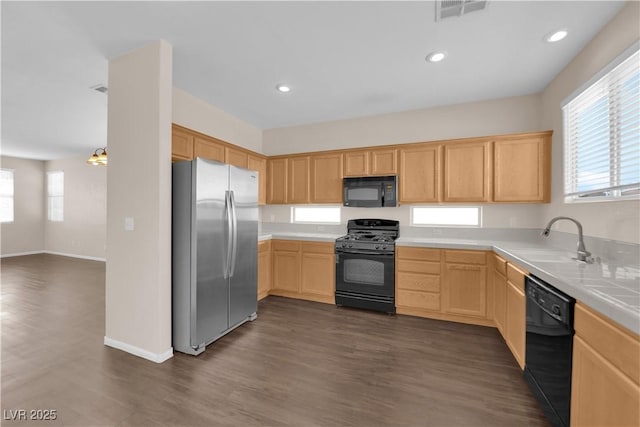 82 Autumn Day St, Henderson, NV 89012 - kitchen featuring black appliances, a sink, light brown cabinets, dark wood-style flooring, and recessed lighting