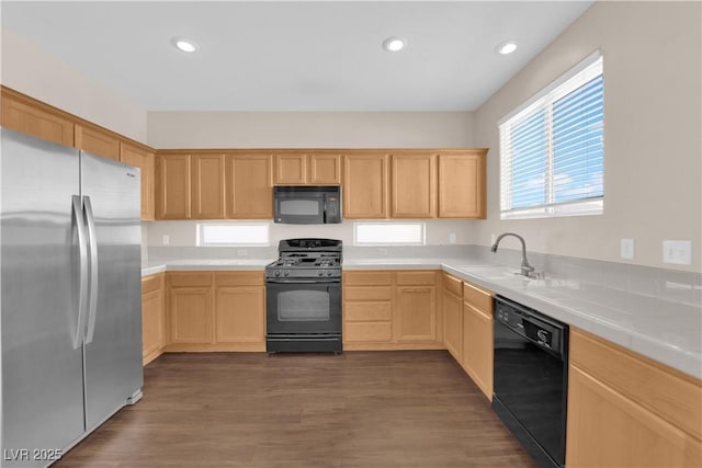 82 Autumn Day St, Henderson, NV 89012 - kitchen with black appliances, a sink, light brown cabinetry, healthy amount of natural light, and recessed lighting