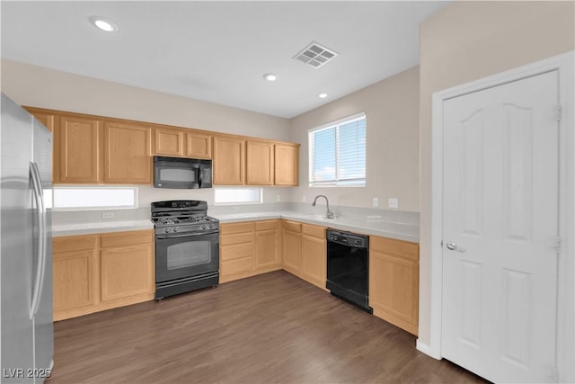 82 Autumn Day St, Henderson, NV 89012 - kitchen with black appliances, light brown cabinetry, light countertops, dark wood-style floors, and a sink