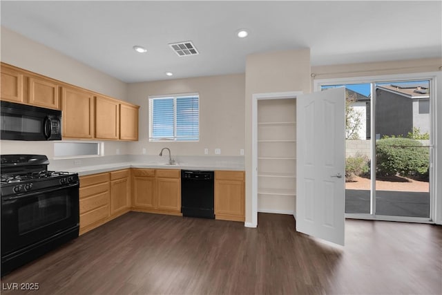 82 Autumn Day St, Henderson, NV 89012 - kitchen with black appliances, light brown cabinetry, light countertops, dark wood finished floors, and recessed lighting