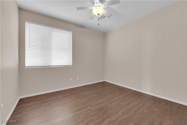 82 Autumn Day St, Henderson, NV 89012 - unfurnished room with wood finished floors, baseboards, and a ceiling fan