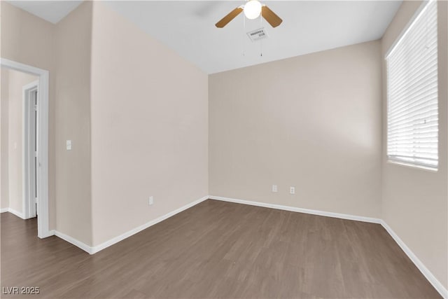 82 Autumn Day St, Henderson, NV 89012 - spare room with a ceiling fan, wood finished floors, and baseboards