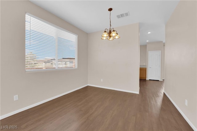 82 Autumn Day St, Henderson, NV 89012 - empty room featuring a chandelier, dark wood finished floors, baseboards, and recessed lighting