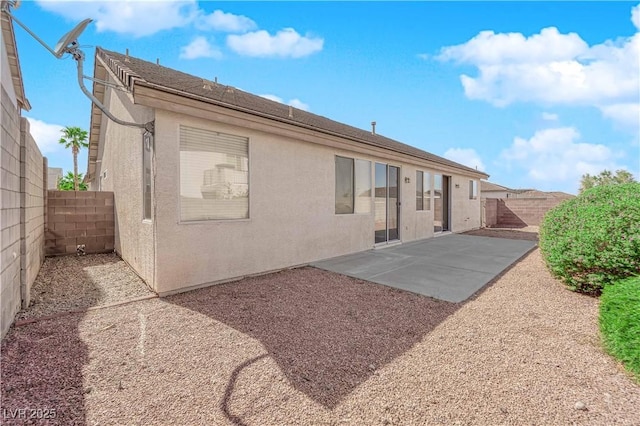 82 Autumn Day St, Henderson, NV 89012 - back of property with a fenced backyard, a patio, and stucco siding