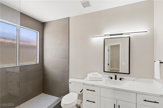 191 Reed Ln, Henderson, NV 89074 - full bathroom featuring toilet, vanity, and a tile shower