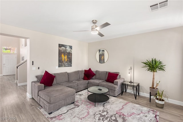191 Reed Ln, Henderson, NV 89074 - living room featuring wood finished floors, a ceiling fan, and baseboards