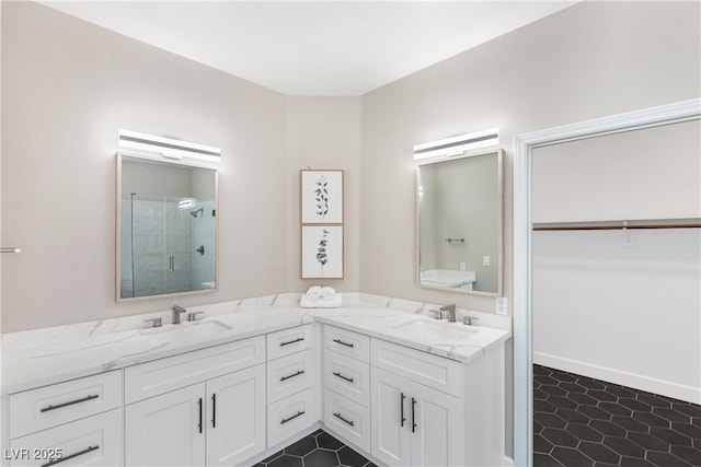 191 Reed Ln, Henderson, NV 89074 - bathroom featuring a shower stall, double vanity, and tile patterned floors