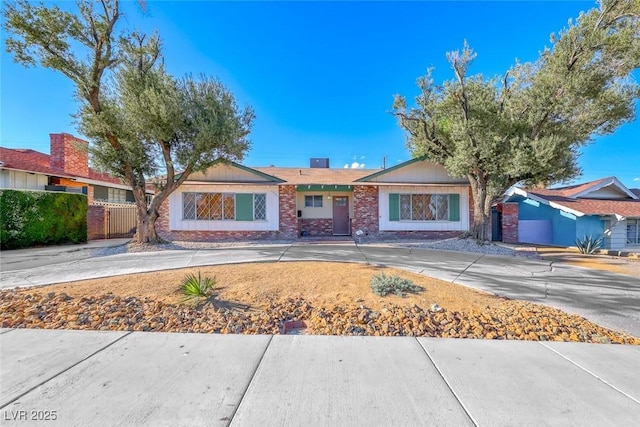 1721 E Oakey Blvd, Las Vegas, NV 89104 - ranch-style home featuring brick siding and fence