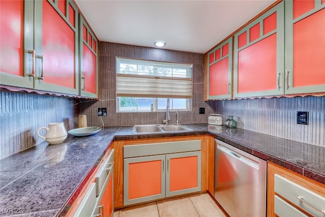 1721 E Oakey Blvd, Las Vegas, NV 89104 - kitchen with stainless steel dishwasher, a sink, decorative backsplash, light tile patterned flooring, and tile counters