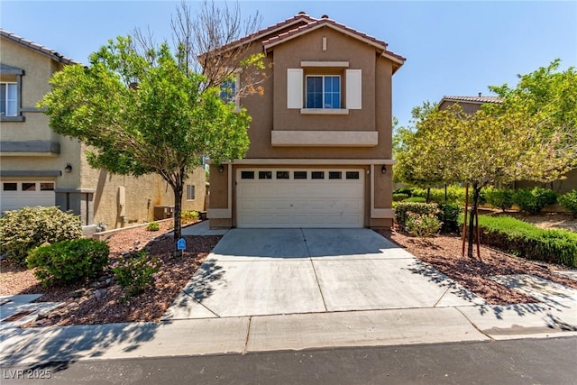 traditional-style home with stucco siding, concrete driveway, an attached garage, and a tile roof