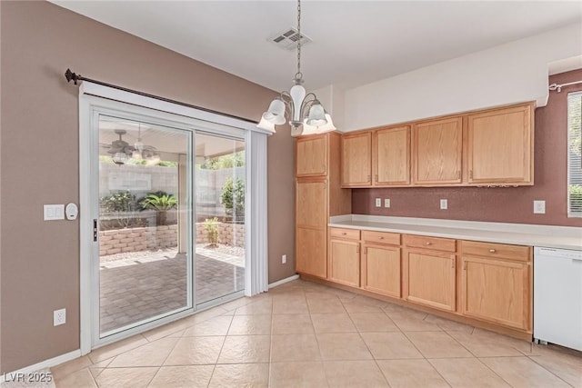 kitchen with a chandelier, dishwasher, light brown cabinets, and light countertops