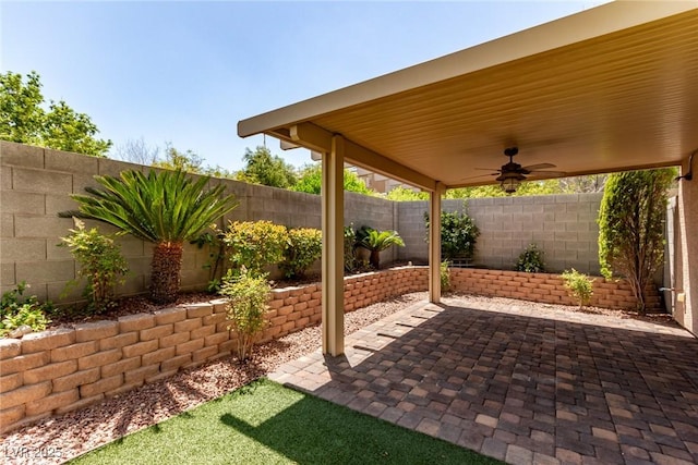 view of patio / terrace with a ceiling fan and a fenced backyard