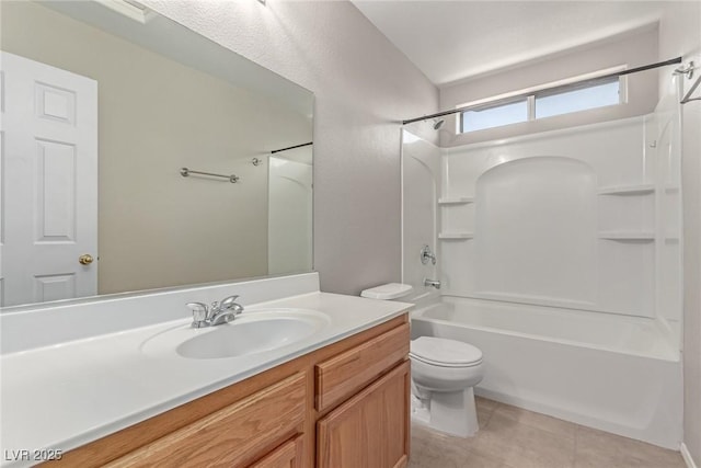 bathroom featuring tile patterned flooring, toilet, vanity, and shower / bathtub combination