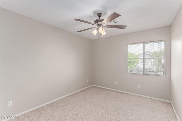 unfurnished room featuring carpet flooring, baseboards, and a ceiling fan