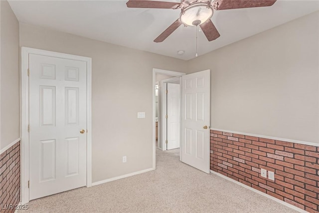 unfurnished bedroom featuring carpet flooring and ceiling fan