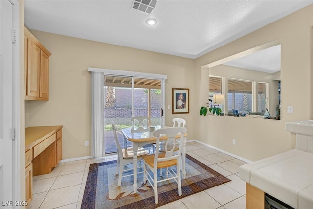2309 Tedesca Dr, Henderson, NV 89052 - dining area featuring light tile patterned floors and baseboards