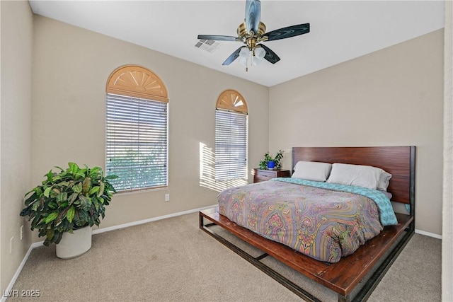 2309 Tedesca Dr, Henderson, NV 89052 - carpeted bedroom featuring multiple windows, baseboards, and ceiling fan