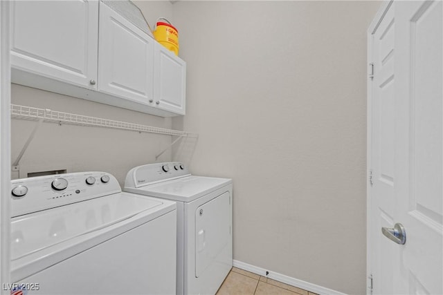 2309 Tedesca Dr, Henderson, NV 89052 - washroom with cabinet space, independent washer and dryer, baseboards, and light tile patterned floors