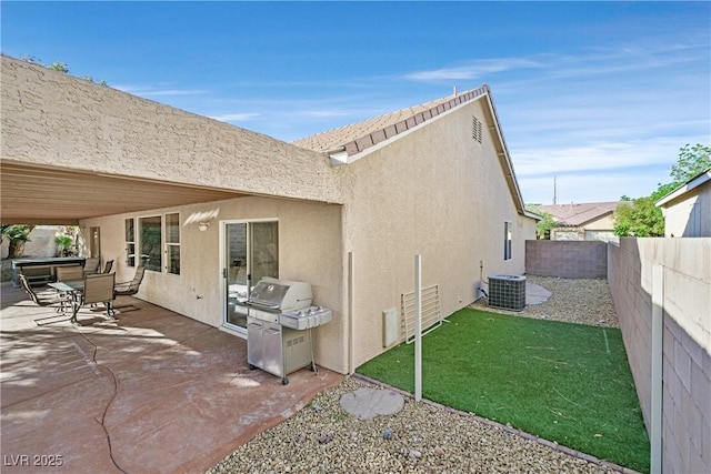 2309 Tedesca Dr, Henderson, NV 89052 - fenced backyard featuring grilling area, a patio area, and cooling unit