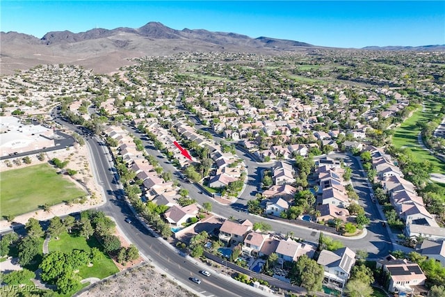 2309 Tedesca Dr, Henderson, NV 89052 - aerial overview of property's location with a mountainous background and nearby suburban area