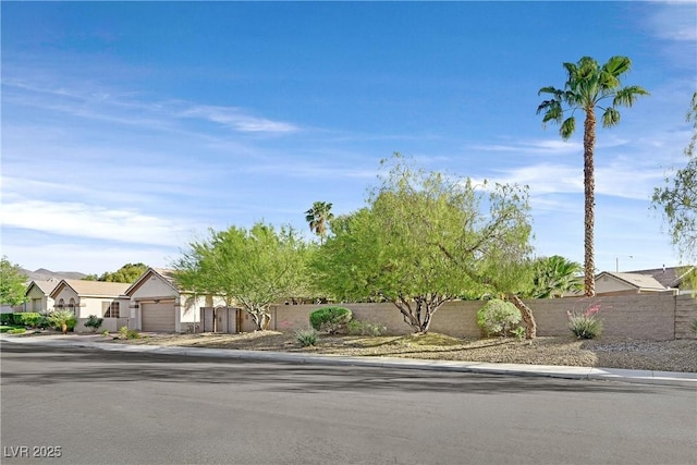 2309 Tedesca Dr, Henderson, NV 89052 - view of property hidden behind natural elements featuring a garage and a residential view