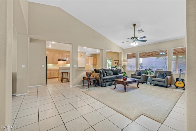 2309 Tedesca Dr, Henderson, NV 89052 - living room featuring light tile patterned floors, a ceiling fan, high vaulted ceiling, and baseboards