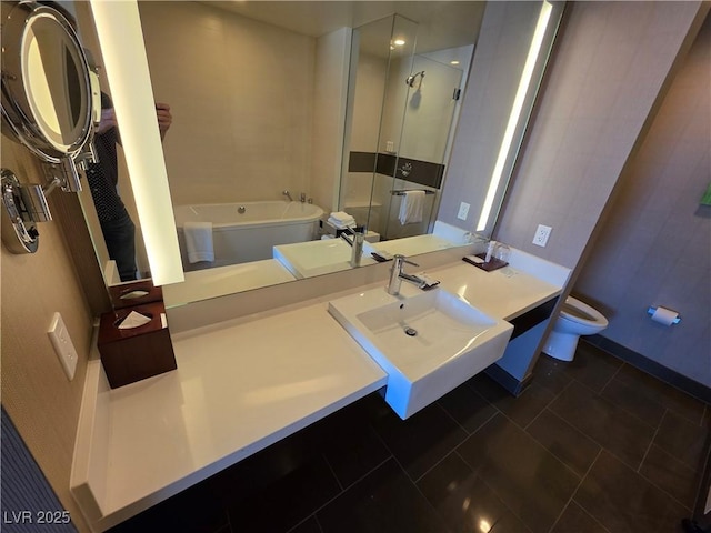 full bathroom with toilet, a bath, a shower stall, baseboards, and vanity
