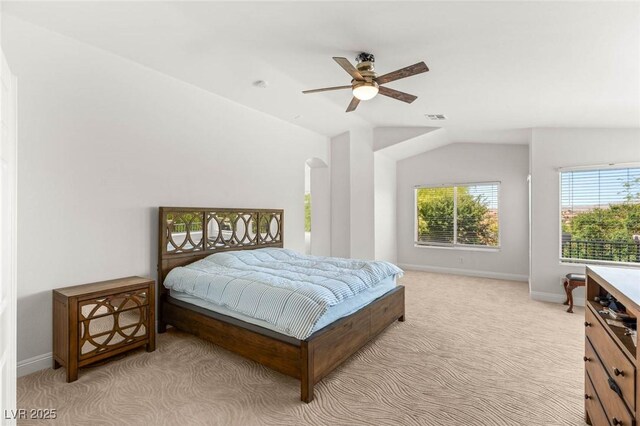 2940 Cimini Ct, Henderson, NV 89052 - bedroom featuring baseboards, vaulted ceiling, light colored carpet, and a ceiling fan
