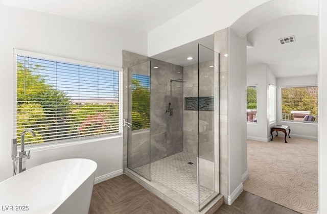 2940 Cimini Ct, Henderson, NV 89052 - bathroom featuring a shower stall, baseboards, and a freestanding bath