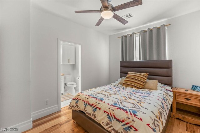 2940 Cimini Ct, Henderson, NV 89052 - bedroom with light wood finished floors, ensuite bath, baseboards, and a ceiling fan