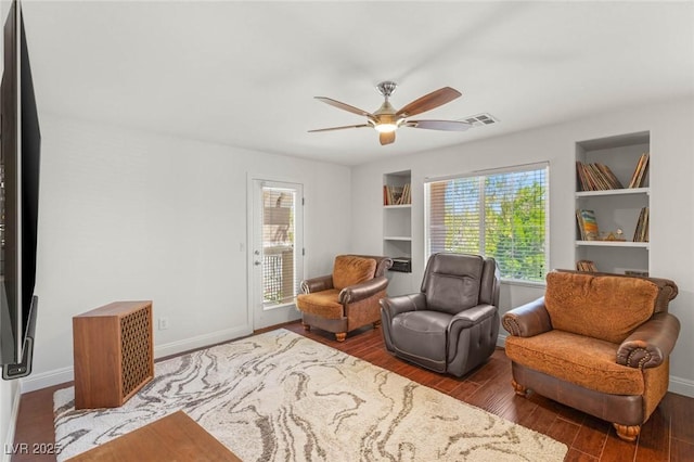 2940 Cimini Ct, Henderson, NV 89052 - sitting room featuring wood finished floors, ceiling fan, and baseboards