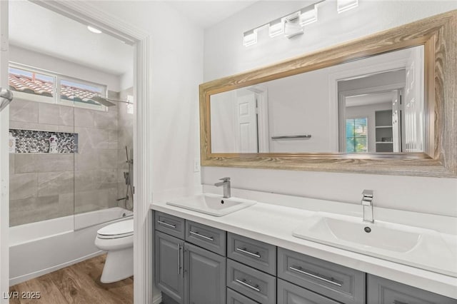 2940 Cimini Ct, Henderson, NV 89052 - bathroom with toilet, wood finished floors, double vanity, and shower / bath combination