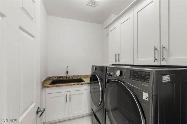 2940 Cimini Ct, Henderson, NV 89052 - laundry room with cabinet space and washing machine and dryer